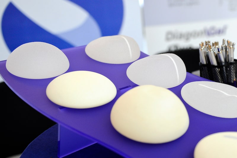 Silicone breast implants on table.